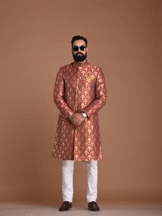 "Important Instrucitons : We request you to kindly calculate the processing time of your order after the mutual confirmation on Bespoke measurements between us has taken place (either via message , e mail or form) \"Crafted with Passion in India; loved by men across the USA, Canada, Europe\" Material: Brocade Color: Red Golden Collar type: Mandarin , Sherwani with 7 Buttons Package contents: 1 Achkan + 1 Churidar/ Trouser Pajama Wash Care Instruction : Dry-clean only Achkans also known as Sherwa Banarasi Silk Kurta For Eid Reception, Long Sleeve Traditional Wear With Meenakari For Diwali, Long Sleeve Traditional Wear With Meenakari For Eid, Long Sleeve Meenakari Traditional Wear For Eid, Eid Long-sleeve Meenakari Traditional Wear, Eid Meenakari Long Sleeve Traditional Wear, Wedding Brocade Sets With Meenakari Details, Traditional Festive Sets For Ceremony, Traditional Festive Ceremony Sets