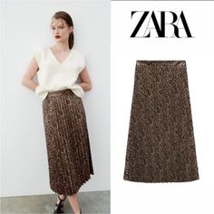 Zara Faux Leather Pleated Snakeskin Skirt Blogger's Fave! Zara Faux Leather Pleated Snakeskin Skirt New With Tags / Completely Sold Out / Hard To Find Size Xs High-Waisted Midi Skirt Side Hidden In-Seam Zip Closure Snake/Tan -Brown Vegan - 100% Polyester (Base Fabric) / 100% Polyurethane (Coating) No Stretch / Please See Measurements Approximate Flat Measurements: Waist: 13" Hips 15” Length: 32” The Photos Don;T Do This Skirt Justice --Super Cute!!! # Rare Snake Croc Animal Print Snakeskin Pleat Zara Brown Skirt For Fall, Chic Brown Zara Skirt, Zara Lined Brown Skirt, Zara Brown Lined Skirt, Zara Brown Skirt For Spring, Snakeskin Skirt, Midi Sweater Skirt, Zara Midi Skirt, Flower Print Skirt