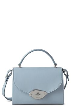 The label's new Foundry lock brings contemporary asymmetry to a compact crossbody bag shaped from smooth leather. Turnlock flap closure Top carry handle; adjustable crossbody strap Interior wall pocket Exterior slip pocket Lined Leather Made in Turkey Designer Handbags Modern Shoulder Bag With Flap And Top Carry Handle, Blue Top Handle Flap Bag With Adjustable Strap, Blue Flap Bag With Detachable Strap, Modern Crossbody Flap Bag With Top Carry Handle, Modern Crossbody Flap Bag With Top Handle, Blue Crossbody Flap Bag With Top Carry Handle, Modern Blue Top Handle Flap Bag, Blue Crossbody Saddle Bag With Detachable Strap, Blue Shoulder Bag With Detachable Strap And Round Handle