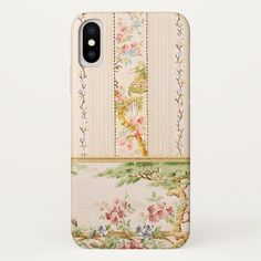 an iphone case with flowers and birds on the front, sitting against a white background