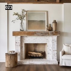 a living room with a white brick fireplace