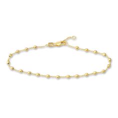 Distinctive diamond-cut beads brighten links around the length of this timeless women's station bracelet. Fashioned in 14K yellow gold, the adjustable 7.5-inch cable chain secures in place with a lobster clasp. Everyday Yellow Gold Beaded Chain Bracelets, Classic Yellow Gold Bracelet With Adjustable Chain, Delicate Yellow Gold-plated Chain Bracelet, Yellow Gold Diamond Bracelet With Adjustable Chain, Classic Yellow Gold Diamond Bracelet With Adjustable Chain, Jared The Galleria Of Jewelry, Cable Chain, Fashion Bracelets, Diamond Jewelry