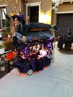 a house decorated for halloween with decorations and lights