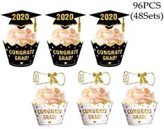 graduation cupcakes are decorated in black and gold with the words congrat grad