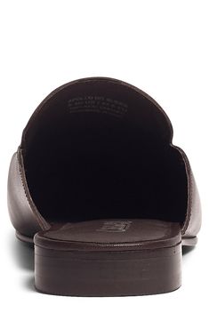 A leather mule topped with a shining metal bit is a timeless silhouette that elevates any refined ensemble with polished detail. Leather upper and lining/rubber sole Imported Leather Mules With Suede Lining For Work, Formal Leather Mules With Suede Lining, Classic Leather Mules With Suede Lining, Classic Synthetic Mules For Work, Classic Slip-on Synthetic Mules, Synthetic Mules With Leather Footbed For Work, Classic Synthetic Mules For Office, Classic Closed Toe Synthetic Mules, Elegant Leather Mules With Suede Lining