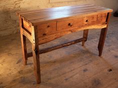 an old wooden desk with two drawers on one side and a drawer on the other