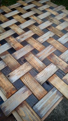 a table made out of wooden boards on the ground