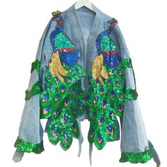 a jacket with green, blue and gold sequins on the back of it