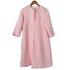 This vintage pink robe from Vanity Fair provides a stylish and comfortable option for your loungewear collection. The robe features a classic design with a soft, flowy material that drapes elegantly over your body. The brand's attention to detail is evident in the delicate lace trim around the cuffs and neckline, adding a feminine touch to the overall look. Perfect for lazy weekends or cozy evenings at home, this robe is a great addition to any wardrobe. It's a beautiful piece of vintage clothin Spring Long Robe For Home, Long Spring Robe For Home, Spring Overnight Robe With Long Sleeves, Spring Overnight Long Sleeve Robe, Feminine Long Sleeve Robe For Daywear, Feminine Long Sleeve Robe For Home, Feminine Long Sleeve Home Robe, Long Spring Sleepwear, Vintage Long Sleeve Robe For Spring