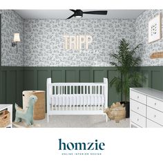 a baby's room with green walls and white furniture