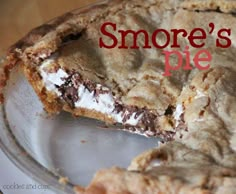 there is a piece of pie that has been cut in half on a plate with the word smore's me written above it