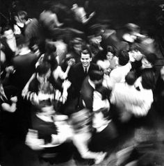 black and white photograph of people in motion