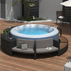 an inflatable hot tub sitting on top of a wooden floor next to a patio