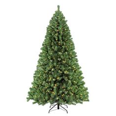 a green christmas tree with lights on it's branches and a black stand in front of a white background