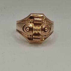 This is an antique ring from the Biedermeier period. The face of the ring is hollow worked as it was common for Biedermeier jewelry.  It's 8k gold. Very unusal! The ring look a little bit like a tank ring or an asian dragon mask to me. Inner diameter is 20mm Approx. size: US 10, UK U 1/2, German 63 It's resizeable! Weight: 4,10gr The pictures are a part of the description & they are enlarged for a better description! Please also have a look at wearing pictures and the dimensions!  The boxes in t Antique Engraved Ring With Decorative Band, Victorian Rings With Historical Design For Ceremonial Occasion, Victorian Ceremonial Rings With Historical Design, Antique Hallmarked Gold Dome Ring, Classic Formal Rings With Historical Design, Antique 14k Rose Gold Rings, Antique Hallmarked Yellow Gold Dome Ring, Collectible Gold Rings With Historical Design, Antique Yellow Gold Hallmarked Dome Ring