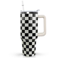 a black and white checkered coffee mug with a straw in the cup, on a white background