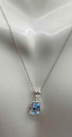 This is a dainty blue topaz pendant necklace in 925 sterling silver.  The chain is 19 inches  Topaz, the November birthstone is also the gemstone associated with the fourth wedding anniversary.  Topaz draws its name from Latin and Greek for Zabargad Island in Foul Bay of the Red Sea, in Egypt.  Also known as St. John's Island, this is believed to be a source of topaz in antiquity.   Topaz is a mineral consisting of silica, aluminum and fluorine.  While a topaz can have a variety of colors, or none at all, the coloration is caused when minerals such as iron, chromium and phosphorous are trapped in the silicon matrix. Topaz signifies love, honesty and confidence.  Topaz helps to connect to and calm the the Third Eye and Throat Chakras.  Topaz contributes to endeavor and accomplishment.  Thes Blue Topaz Heart Pendant Necklace As Gift, Blue Topaz Heart Pendant Necklace For Gift, Light Blue Sterling Silver Birthstone Necklace, Light Blue Birthstone Necklace In Sterling Silver, Light Blue Sterling Silver Necklace Fine Jewelry, Light Blue Sterling Silver Necklace, Silver Necklaces With Blue Topaz Birthstone, Silver Topaz Birthstone Necklaces, Silver Blue Topaz Oval Pendant Necklace