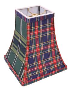 a lamp shade that has a tartan pattern on the bottom and sides, with a gold ring at the top