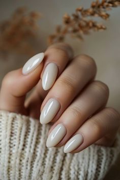 A subtle nod to the natural beauty of nails, this ivory polish is perfect for those who prefer a hint of refinement. It's a quiet celebration of one's inherent style. Tap the link for more old money nail style inspiration! Nails Nod Color, Ivory Color Nails, Off White Oval Nails, Ivory Nails Gel, Old Money Winter Nails, Simple Graduation Nails Classy, Old Money Style Nails, Nail Old Money, Uñas Old Money Aesthetic