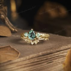 a close up of a ring on top of a book