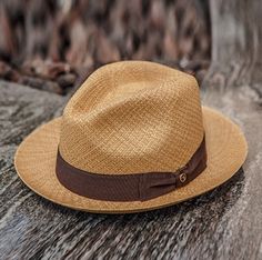 Similar to the Black Bow Band on White Panama Hat also from the Austral Hats line, this hat has a short brim and tear drop style crown accented in a bowed band. This hat comes with a brown band and cafe tan colored genuine panama straw hand woven from 100% Toquilla straw. *Stylish, lightweight, and comfortable. *Snap Brim - Turn up or down for your own style Mens Summer Hats, Mens Straw Hats, Mens Dress Hats, Upf Clothing, Trending Hats, Mens Hats Fashion, Bow Flats, Western Hats, Hat Band