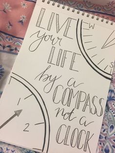 a notepad with writing on it that says live your life by compass not a clock