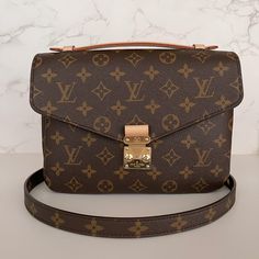 This Is An Authentic Louis Vuitton Pochette Metis Crossbody. This Is A Monogrammed Canvas Made Of Natural Cowhide Trim With Gold Colored Hardware. This Bag Measures At 9.8 X 7.5 X 2.8 Inches With A Drop Strap Of 18.9 To 21.7 Inches. The Strap Is Removable And Adjustable. This Item Is New. It Will Come In Box With Dustbag. More Pictures Can Be Provided Upon Request. Sold Out At Louis Vuitton Formal Flap Bag With Detachable Strap In Monogram Canvas, Formal Monogram Canvas Flap Bag With Detachable Strap, Formal Monogram Canvas Shoulder Flap Bag, Luxury Monogram Canvas Flap Bag With Removable Pouch, Luxury Monogram Canvas Square Shoulder Bag, Designer Monogram Canvas Flap Bag With Detachable Strap, Luxury Monogram Canvas Flap Shoulder Bag, Luxury Monogram Canvas Flap Bag For Formal Occasions, Luxury Formal Monogram Canvas Flap Bag