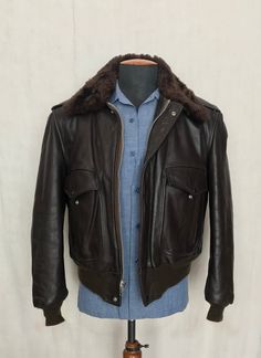 Description: Beautiful vintage brown leather flight bomber jacket made in USA, the jacket is in great condition, made by Golden Fleece. See pictures Marked size: 44 USA , but please refer to measurements A: pit to pit : 56cm B: length from back neck seam to bottom back hem: 64cm C: from neck seam to bottom sleeve hem: 80cm *See last picture for details. *Please view all Detailed Pictures of the item up for offer for exact condition. *Please carefully view all size dimensions of item being offere Classic Brown Aviator Style Outerwear, Classic Brown Aviator Outerwear, Classic Brown Leather Jacket With Padded Collar, Retro Brown Biker Jacket With Pockets, Vintage Leather Aviator Outerwear, Vintage Aviator Leather Outerwear, Brown Leather Aviator Biker Jacket, Fitted Brown Leather Jacket With Padded Collar, Fitted Brown Leather Collared Jacket