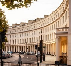 a large white building sitting on the side of a road