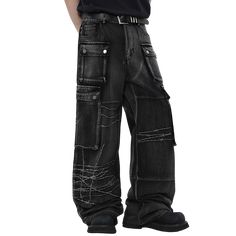 Black wide-leg jeans with a dramatic oversized silhouette. Features multiple large cargo pockets with snap button closures, adding a utilitarian edge. The jeans have a unique distressed design with white embroidered barbed wire patterns across the legs, creating an edgy, punk-inspired look. The denim has a worn, faded black wash for a vintage feel. The extreme wide-leg cut and long length result in a floor-sweeping hem. Combines avant-garde styling with gothic and industrial aesthetics for a bol Punk Style Wide Leg Jeans, Grunge Wide Leg Jeans With Cargo Pockets, Grunge Wide-leg Jeans With Cargo Pockets, Grunge Streetwear Cargo Jeans With Pockets, Y2k Distressed Cargo Jeans For Streetwear, Baggy Punk Cargo Jeans For Streetwear, Grunge Cargo Jeans With Side Pockets, Edgy Cotton Cargo Jeans With Multiple Pockets, Edgy Baggy Distressed Cargo Jeans