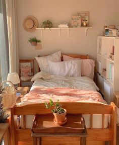 a bed sitting next to a window in a bedroom