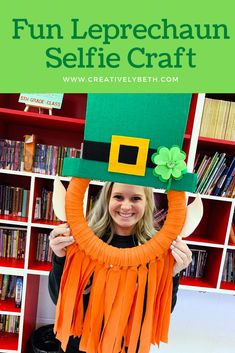 a woman holding up a leprechaun hat in front of her face with text overlay reading fun leprechaun selfie craft