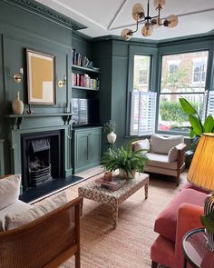 a living room filled with furniture and a fire place in the middle of a room