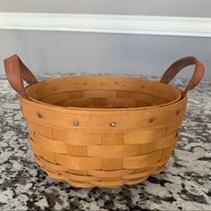 a wooden basket sitting on top of a counter