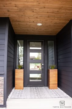 two planters on either side of the front door