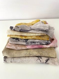 five pieces of cloth stacked on top of each other