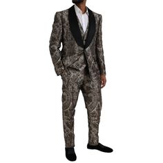 The Dolce & Gabbana 3 piece suit boasts a slim fit with a single breasted one button design. Color: Brown Style: Single breasted 3 piece suit; includes blazer, vest and pants Closure: One button closure Material: 91% Polyester 9% Silk Lining: 90% Silk 10% Viscose Fitting: Slim Fit Inside pockets One open vent in the back Vest has full button closure and an adjustable strap back 3-way pants zipper closure Made in Italy Messenger Bag Backpack, Denim Jacket Men, 3 Piece Suits, Brown Floral, Dolce E Gabbana, Brown Fashion, Dolce & Gabbana, Cardigan Jacket, Brunei