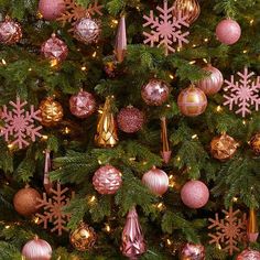 a christmas tree with pink and gold ornaments