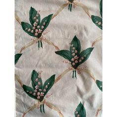 the fabric has flowers and leaves on it