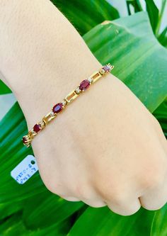 Stunning Vintage 14K Yellow Gold Diamond Ruby Bracelet: Stunning Genuine Diamonds and Natural Ruby 11 pc oval shape 6x4mm Ruby(s): 7.50CT Diamond(s): 0.28CT Color: G Clarity: SI2 Total Bracelet Weight: 11.0GR Bracelet Length: 7in Bracelet Width: 1/2cm 14K Yellow Gold For more information regarding this item feel free to reach me so I can accommodate your needs. Thank you Classic Oval Gemstone Tennis Bracelet, Gold Oval Tennis Bracelet As Gift, Gold Oval Tennis Bracelet In Fine Jewelry Style, Formal Oval Gemstone Tennis Bracelet, Gold Oval Tennis Bracelet In 14k, Gold Oval 14k Gold Tennis Bracelet, Gold 14k Oval Tennis Bracelet, Gold Oval Bracelet With Gemstone, Oval Gold Bracelet With Gemstone For Formal Occasions