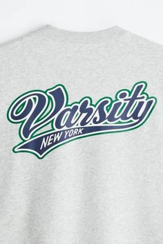 a sweatshirt with the word paris on it in blue and green letters, against a white background