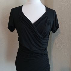 Zeagoo Casual Shirt. Criss-Cross Design Across Bust. Ruched Around Waist. 95% Rayon/5% Spandex. New With Tags. Never Worn. Has Ample Stretch. Flattering Stretch Black Tops, Flattering Black Stretch Tops, Elegant Ruched Top With Short Sleeves, Elegant Short Sleeve Ruched Top, Elegant Ruched Short Sleeve Tops, Tops Casual, Cross Design, Cross Designs, Casual Shirt