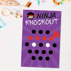 a purple poster with the words ninja knockout on it next to confetti