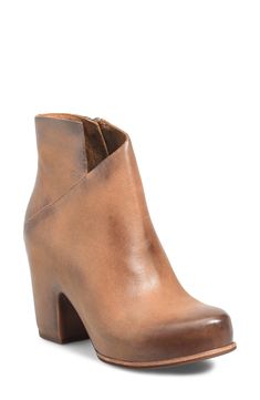 An asymmetric topline adds visual intrigue to a rich leather bootie lifted by a hidden platform and block heel. 3 1/2" heel 4" shaft Side zip closure Cushioned footbed Leather upper and lining/rubber sole Imported Leather High Ankle Boots With 4-inch Heel, Leather Platform Boots With Wedge Heel For Fall, Modern Brown Heeled Boots With Stacked Heel, Leather High Heel Wedge Boots With Sculpted Heel, Leather Platform Boots With Stacked Block Heel, Leather Platform Boots With 4-inch Heel, High Ankle Leather Heels With Deep Heel Cup, Chic Calf Leather Ankle-high Platform Boots, Leather High Ankle Platform Boots With Stacked Heel