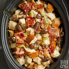 a crock pot filled with stuffing and vegetables