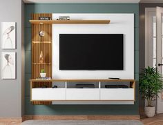 an entertainment center with a flat screen tv mounted on the wall and shelves below it