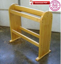 a small wooden rack for storing items on the floor