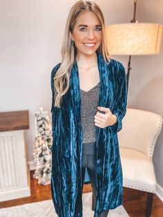 Stand out in style this holiday season! This velvet vertical detail cardigan is flawless! We love the trendy and chic look of this one, pairing perfectly with a bodysuit or tank underneath. Add leggings and boots for a gorgeous look! Features fold over collar, side slit pockets, and the perfect fit! Model is 5’4 and wearing a small 95% Polyester, 5% Spandex Velvet Cardigan, Fold Over, Holiday Season, Perfect Fit, Velvet, Spandex, Leggings, Collar, Boots