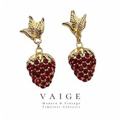 VAIGE Red Strawberry Zirconia Gold Plant Earrings Indulge in the exquisite charm of our Red Strawberry Zirconia Gold Plant Earrings, where elegance meets artistry. Meticulously crafted with high-quality 925 Silver, these earrings showcase a stunning design that effortlessly enhances your style. Features of these remarkable earrings include: Radiant Zirconia Stones: Adorned with vibrant red zirconia that captures light beautifully, adding an eye-catching sparkle. Elegant Drop Design: The graceful Plant Earrings, Drop Design, Red Strawberry, Drops Design, Star Earrings, Black Glass, Vibrant Red, Timeless Classic, Accessories Bracelets