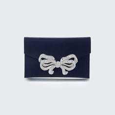 Judith Leiber Couture satin clutch bag with crystal-embellished bow accent. Detachable shoulder strap, 18.9" drop. Envelope flap with snap closure. Interior, satin lining; one slip pocket. 5"H x 8.5"W x 0.5"D. Imported. Judith Leiber Bags, Judith Leiber Couture, Bow Clutch, Satin Clutch, Black Envelopes, Envelope Clutch Bag, Crystal Clutch, Envelope Bag, Judith Leiber